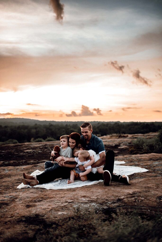 Beautiful family on top of a mountain top for family photos.