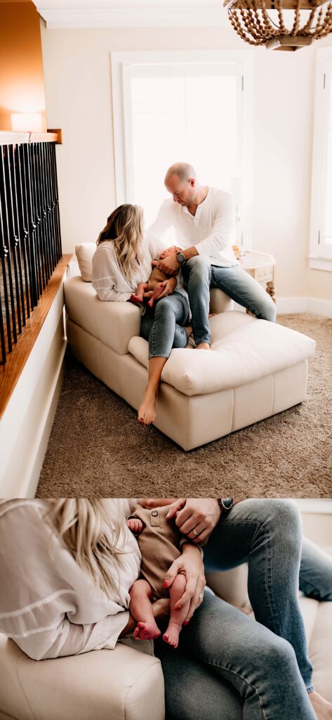 Mom and dad holding their newborn on their couch for family newborn photos.