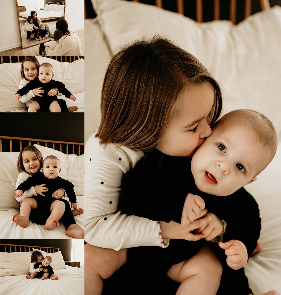 Sister hold baby brother for photo session.